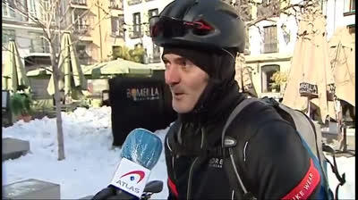 Man falling with his bike in the snow after saying he was grabbing