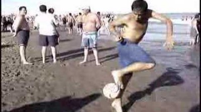 A man does Maradona's "Live is Life" training on the beach